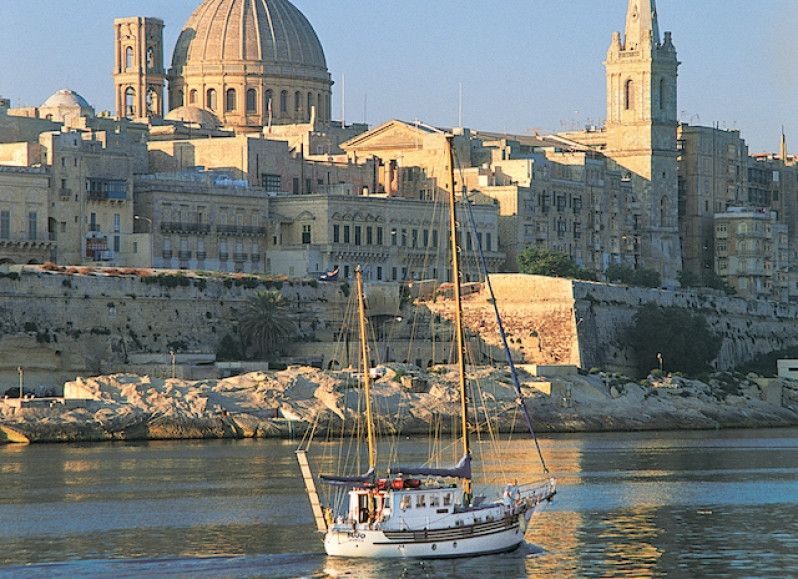 Il Calare del sole sull'antico porto di Masamxett, alla Valletta. Foto di Nicholas Pitt/Getty